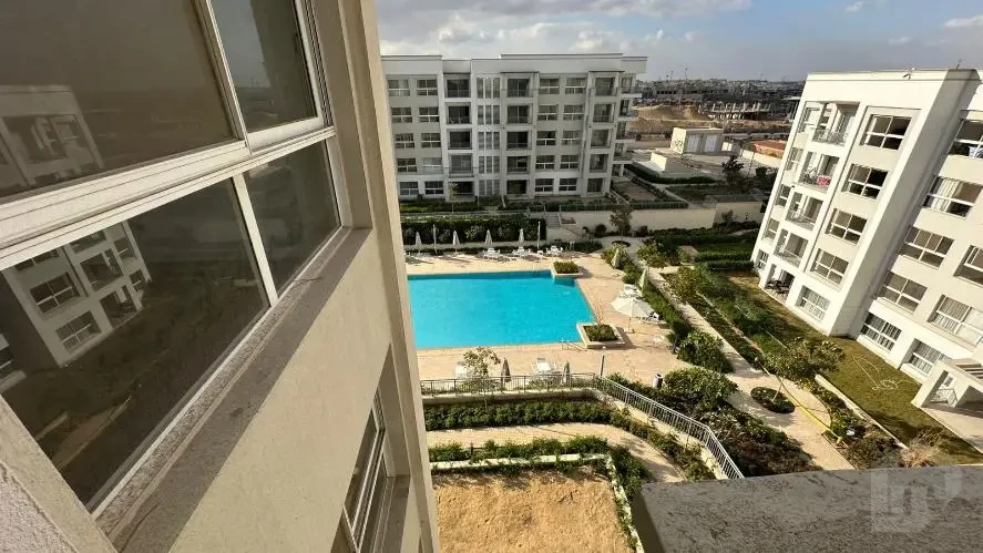 Apartment for rent in Mivida Blue Views New Cairo pool view