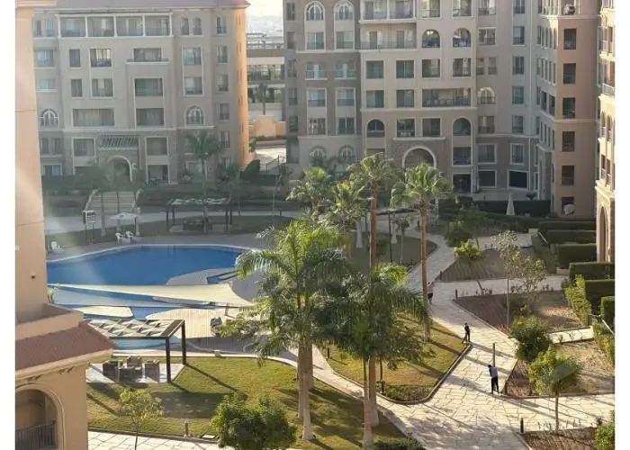 Pool view from an apartment for sale in 90 Avenue Compound Fifth Settlement