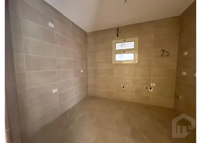 Kitchen finishing in an apartment for sale in 90 Avenue Compound