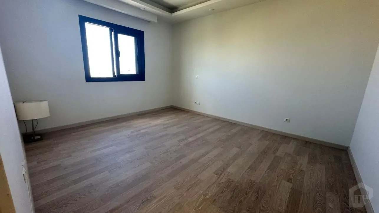 Spacious reception area in a 235m apartment for sale in Mivida compound