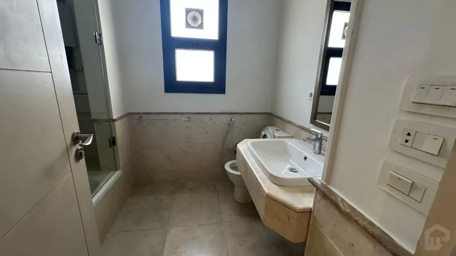 Modern bathroom finishing in a 235 sqm apartment for sale in Mivida