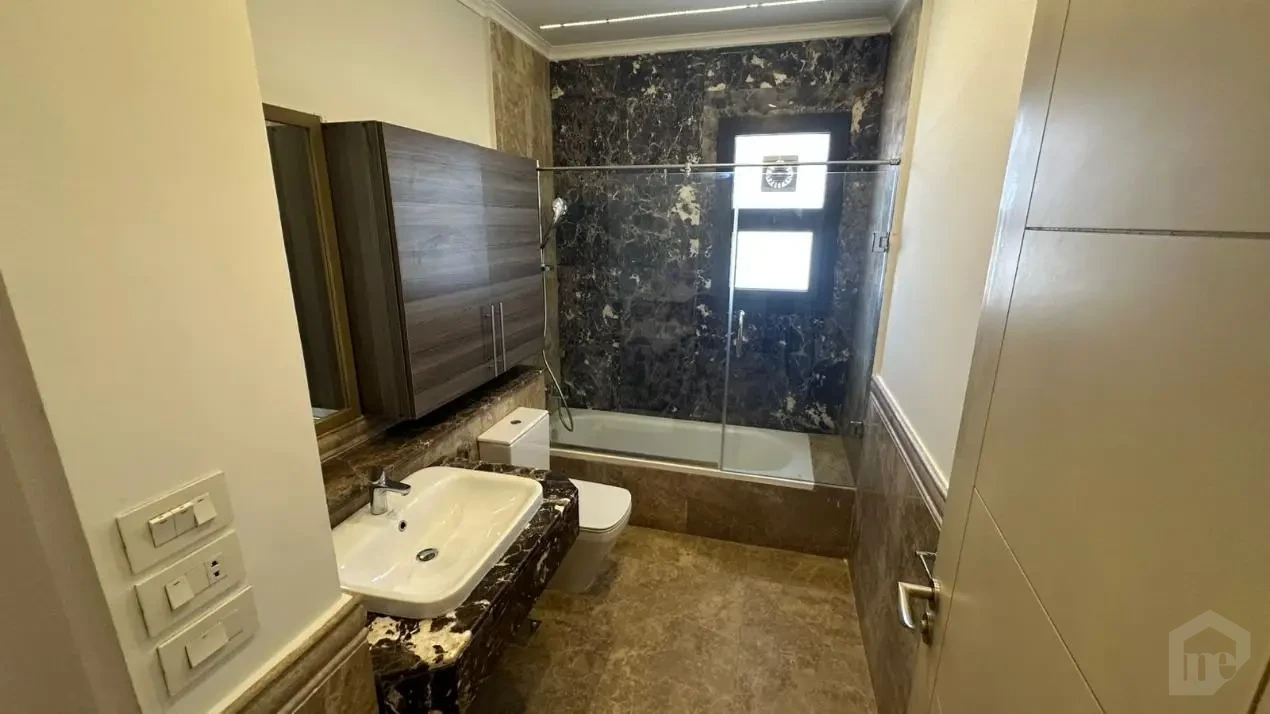 Luxury bathroom finishes in a 235 sqm apartment for sale in Mivida compound.