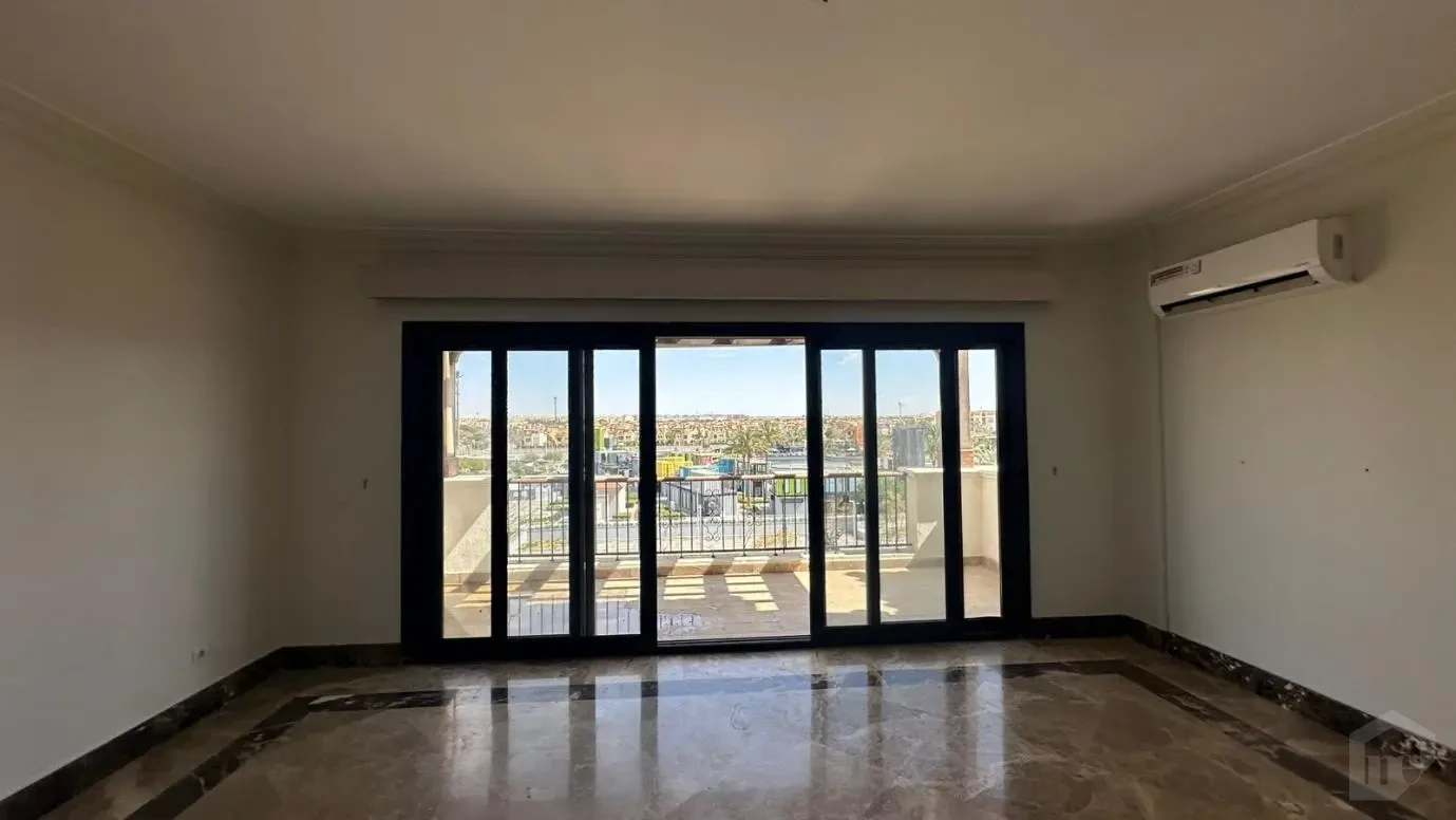 Bright reception area with terrace access in a 235m apartment for sale in Mivida.