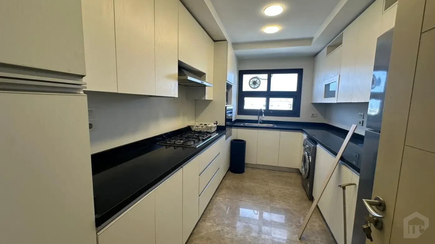 Fully equipped modern kitchen in an apartment for sale in Mivida