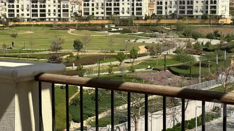 Scenic landscape view from a balcony in an apartment for sale in Mivida