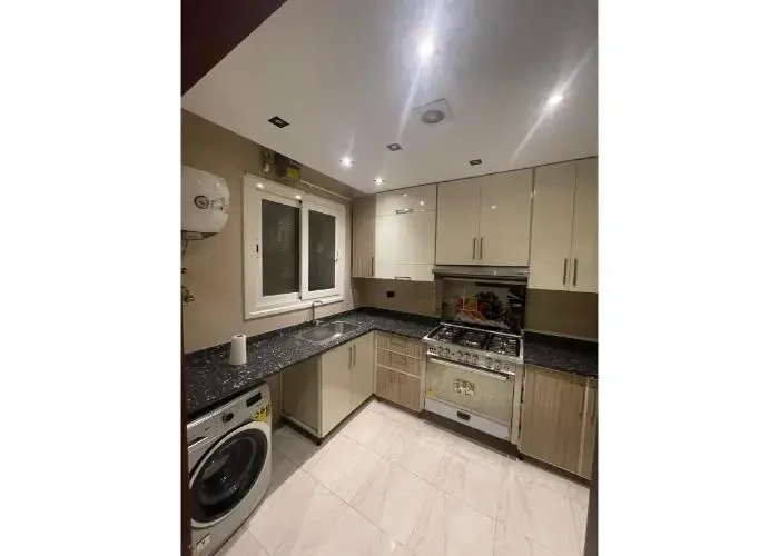 Apartment for sale in Regents New Cairo kitchen with modern cabinets