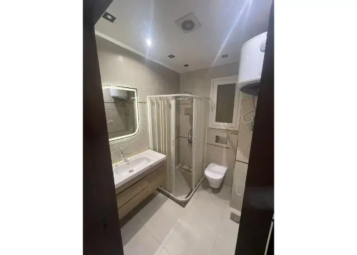 Apartment for sale in Regents New Cairo modern bathroom with shower cabin