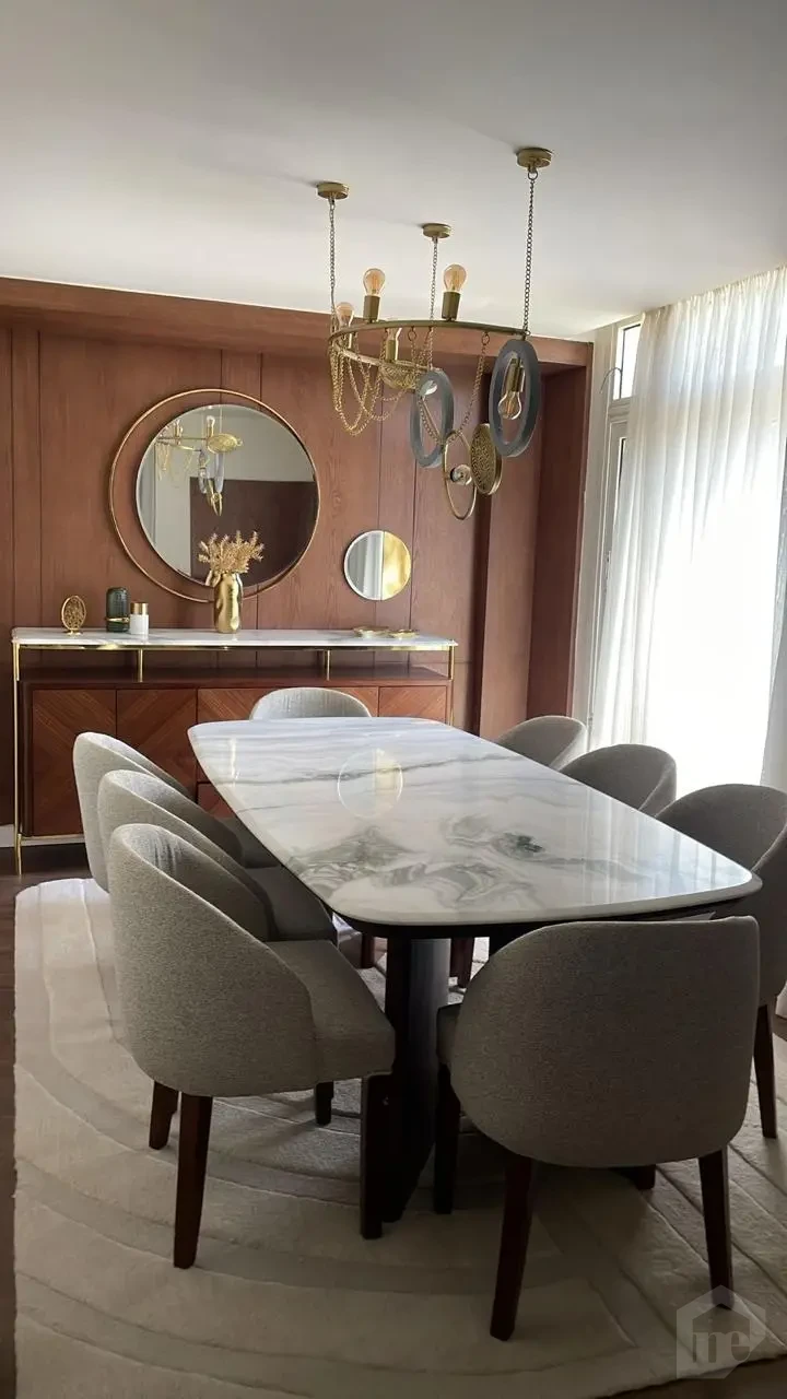 Modern dining area in an apartment for sale in Taj City 145m