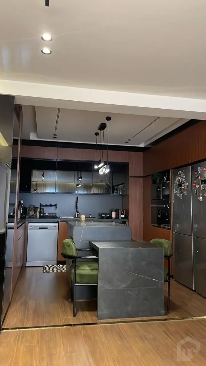 Modern kitchen in an apartment for sale in Taj City 145m