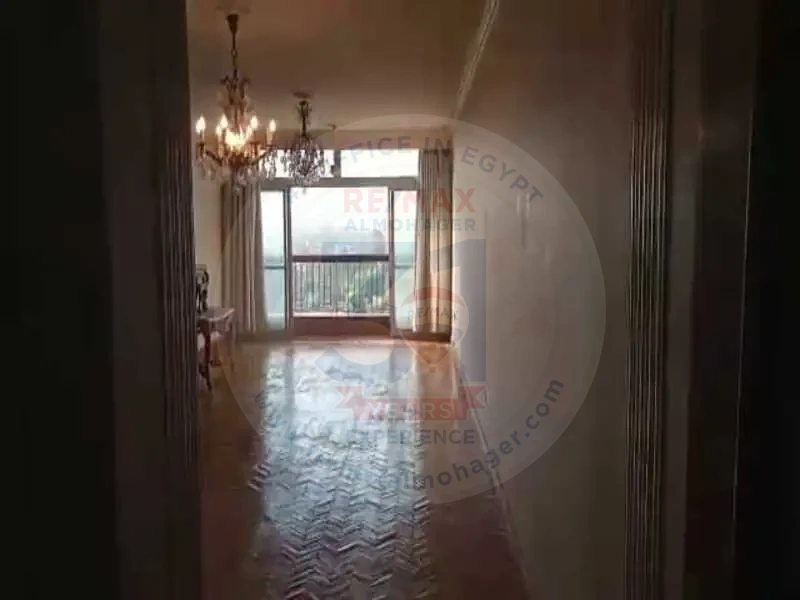 Spacious living room with balcony door in Obour Buildings apartment