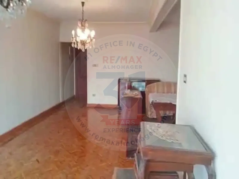 Bedroom with wooden flooring in Obour Buildings apartment