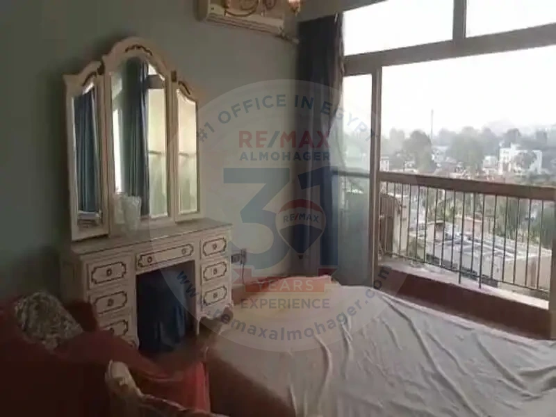Bedroom with balcony view in Obour Buildings apartment