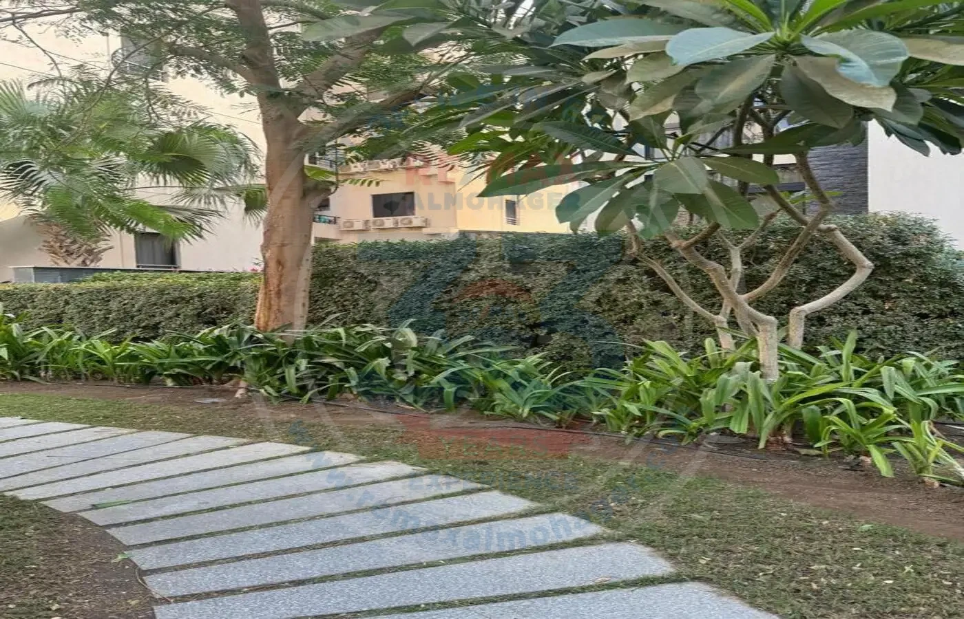 Garden of apartment for sale in Waterway 1 Compound