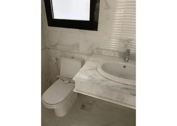 Bathroom finishing in apartment for sale Sodic East Town