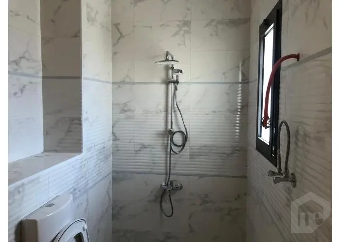 Bathroom shower area in Sodic East Town apartment for sale