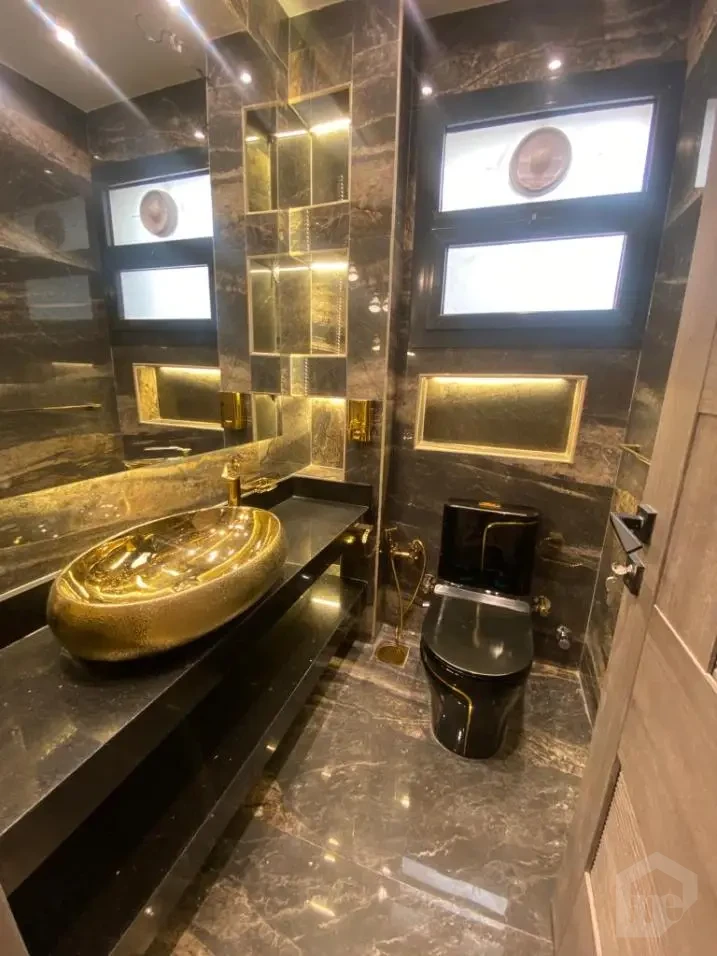 Duplex for rent in Azad New Cairo bathroom with gold details