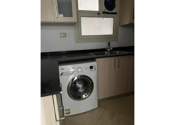 Modern equipped kitchen in an apartment for sale in New Cairo