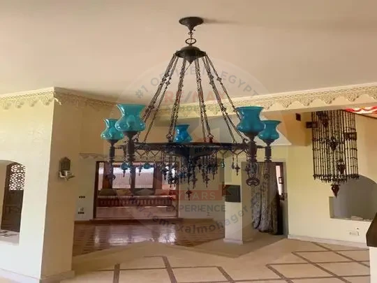 Villa for sale in Tara Compound interior hall with luxury chandelier and oriental touches
