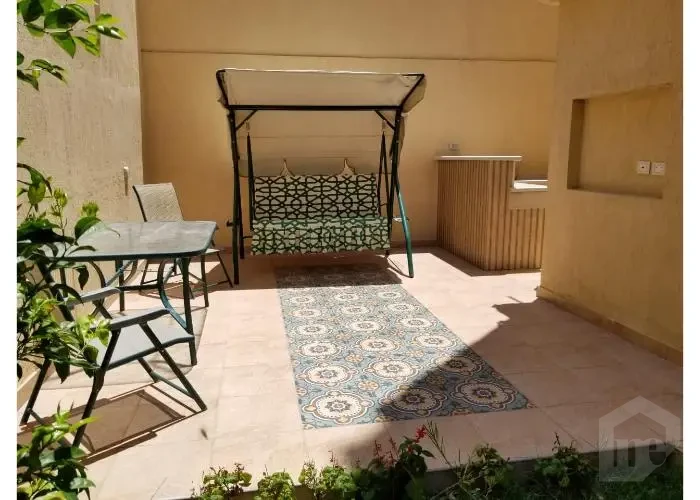 Private garden of a furnished apartment for rent in Banafseg area