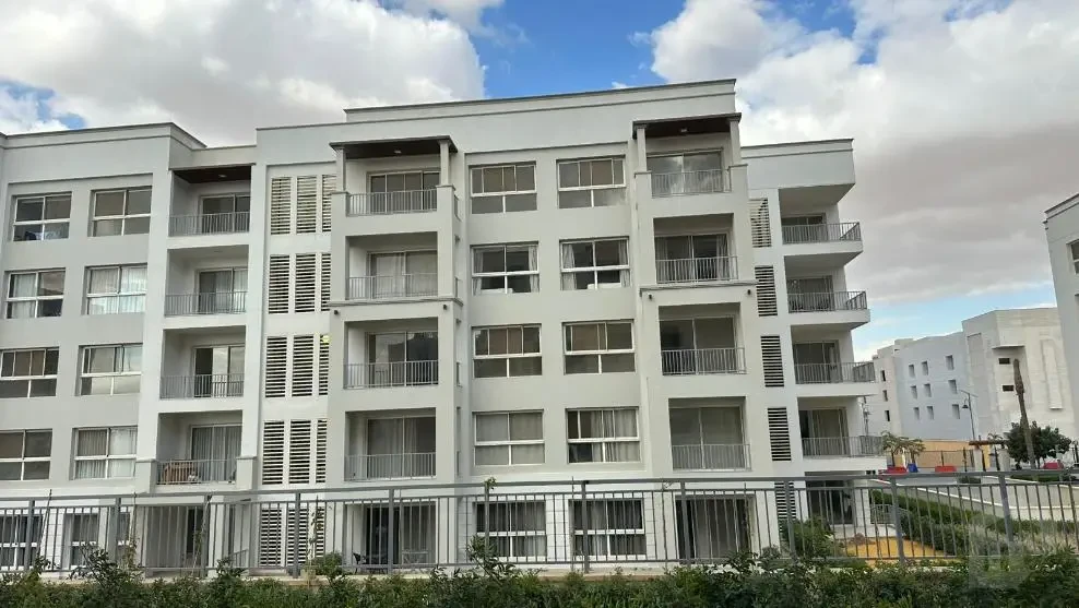 Ground floor apartment with garden for rent in Mivida Blue Views facade