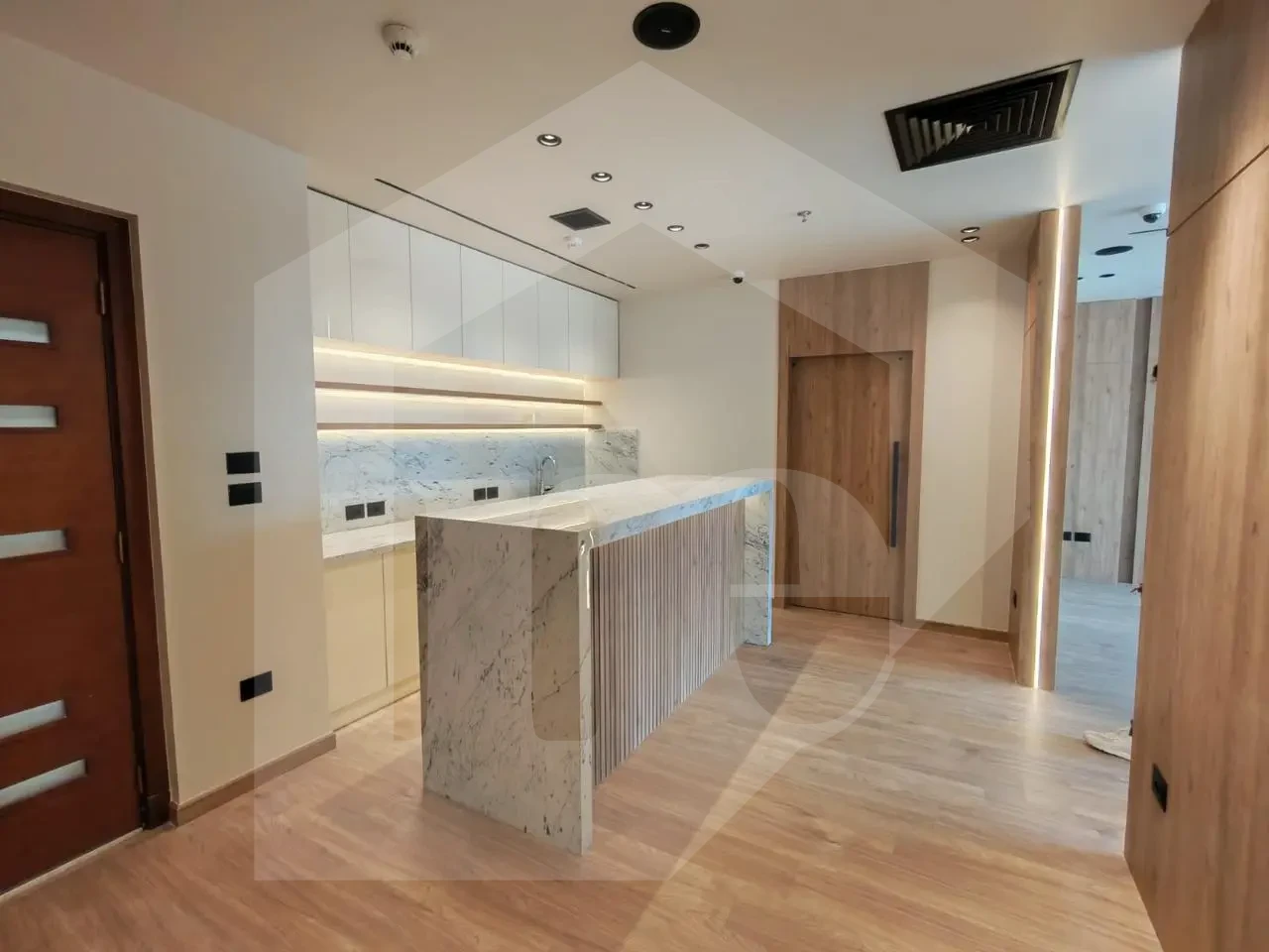 Modern office for sale in Mivida Park featuring contemporary design and wood accents.