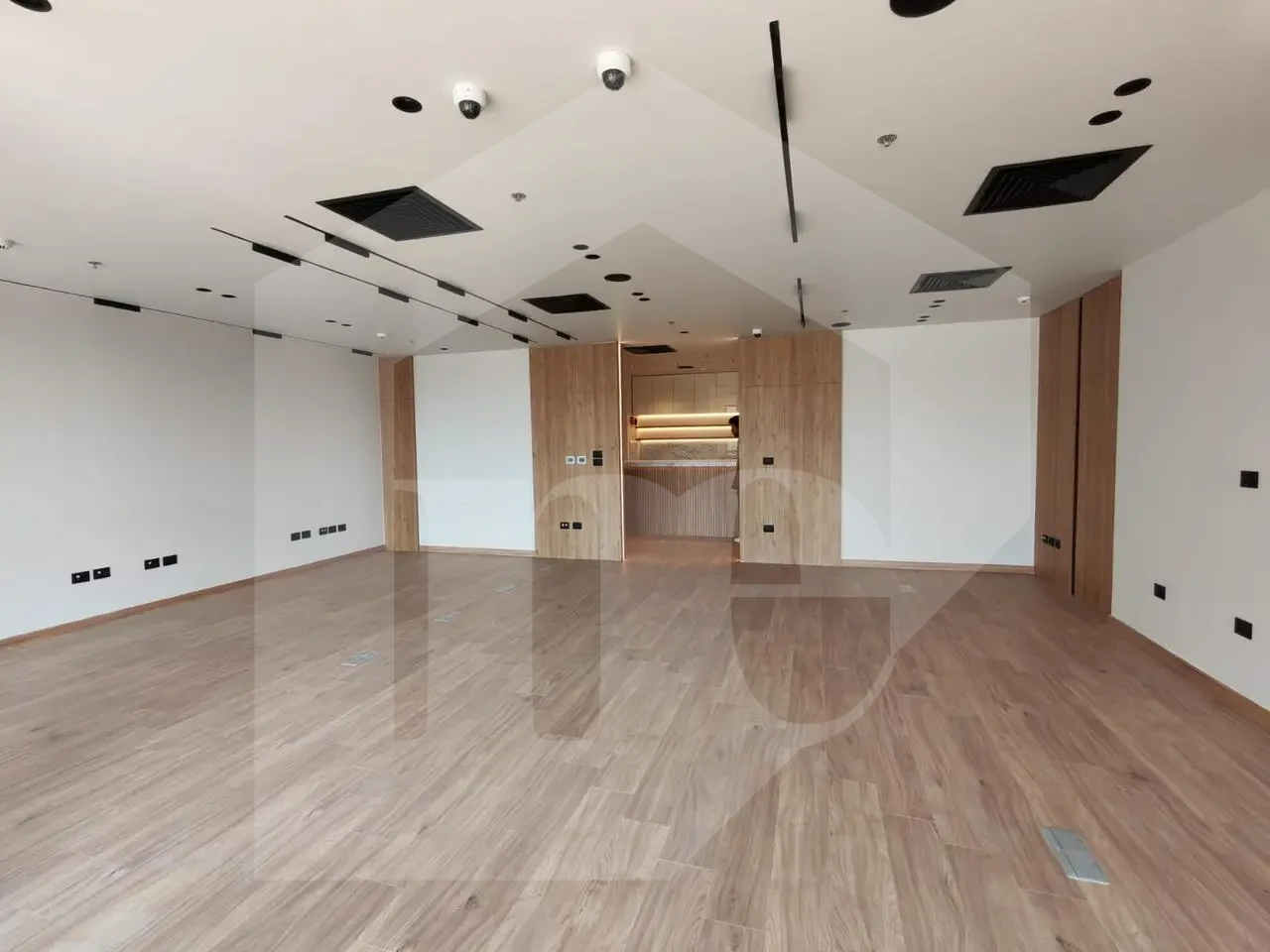 Elegant administrative office for sale in Mivida Park with a marble reception area.