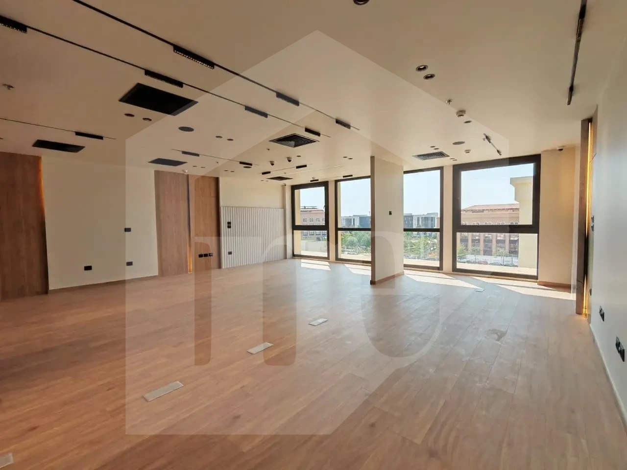 Fully finished office for sale in Mivida Park with elegant wood floors