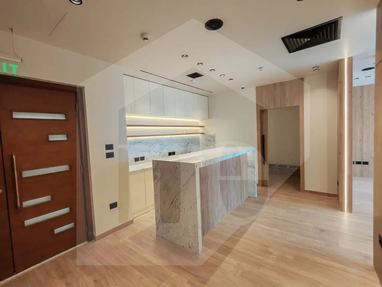 Premium office for sale in Mivida Park featuring a marble reception desk