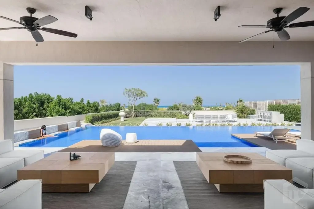 Outdoor seating area by pool in Hacienda Bay North Coast villa